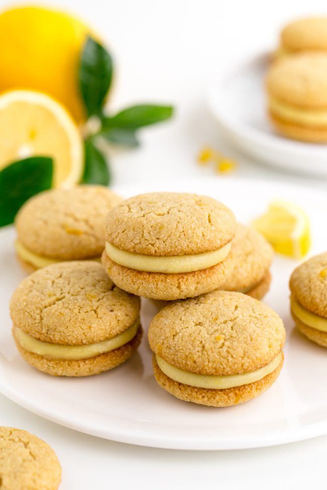 Lemon curd is sandwiched between soft and chewy paleo lemon cookies in this dairy-free treat!