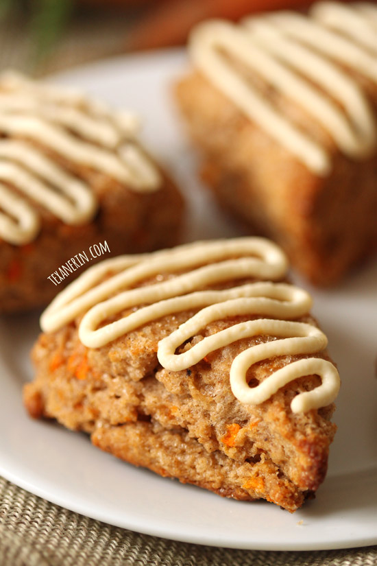 These healthier carrot cake scones are made with 100% whole grains, less sugar and maple sweetened cream cheese frosting!