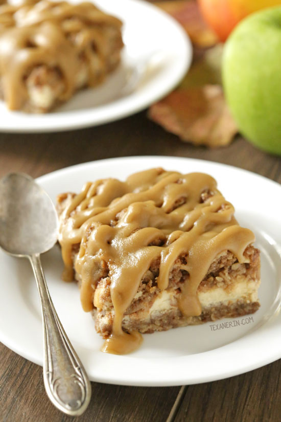 These caramel apple cheesecake bars feature an oatmeal cookie-like crust and topping with a simple caramel glaze! They're oat-based making them gluten-free as well as 100% whole grain.