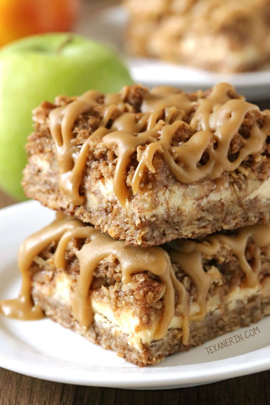 These caramel apple cheesecake bars feature an oatmeal cookie-like crust and topping with a simple caramel glaze! They're oat-based making them gluten-free and 100% whole grain.