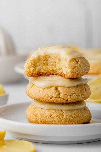 3 stacked paleo lemon cookies on white plate