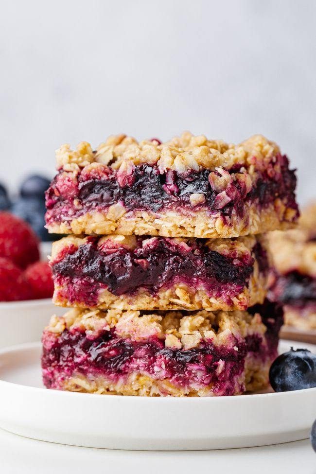 These berry bars have a thick layer of blueberries mixed with berry jam nestled between a crumb-like crust and topping! Can be made with all-purpose, gluten-free or whole wheat flour. Can also be made vegan and dairy-free.