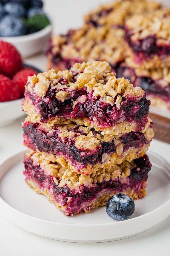 These berry bars have a thick layer of blueberries mixed with berry jam nestled between a crumb-like crust and topping! Can be made with all-purpose, gluten-free or whole wheat flour. Can also be made vegan and dairy-free.