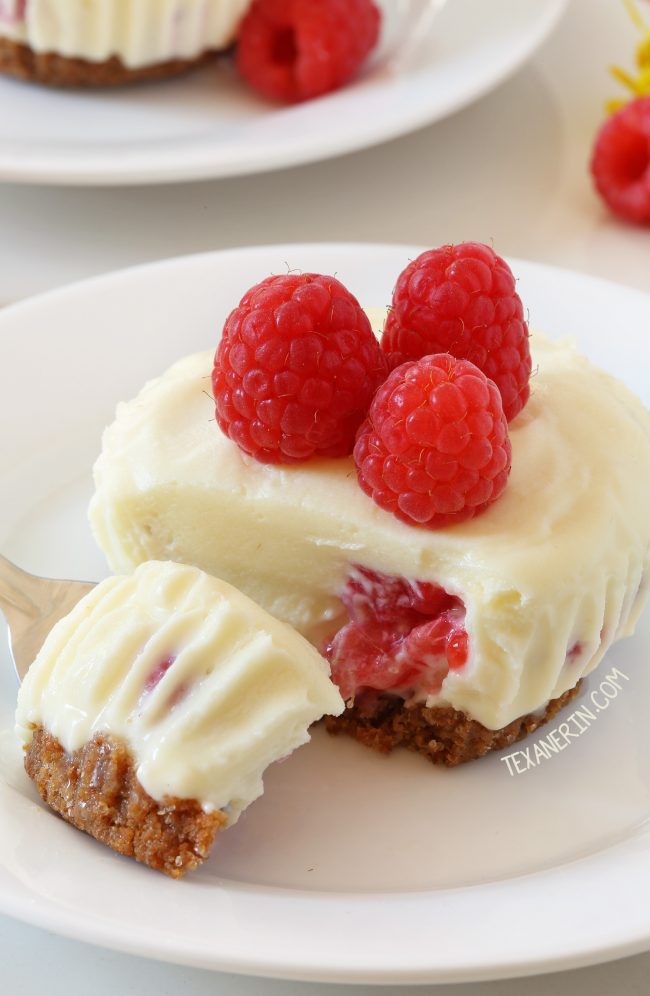 These no-bake mini raspberry cheesecakes feature a white chocolate cheesecake filling and a graham cracker crust. With traditional, grain-free, gluten-free, and whole grain options.