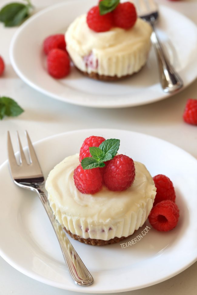 These no-bake mini raspberry cheesecakes feature a white chocolate cheesecake filling and a graham cracker crust. With  traditional, gluten-free, whole grain and grain-free options. Add some mint leaves for a Christmas-time treat!
