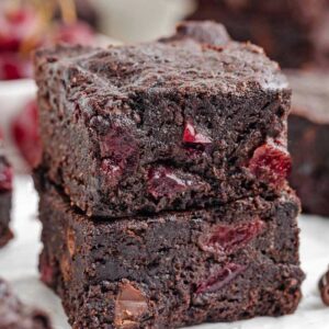 close-up of cherry brownies on a white plate