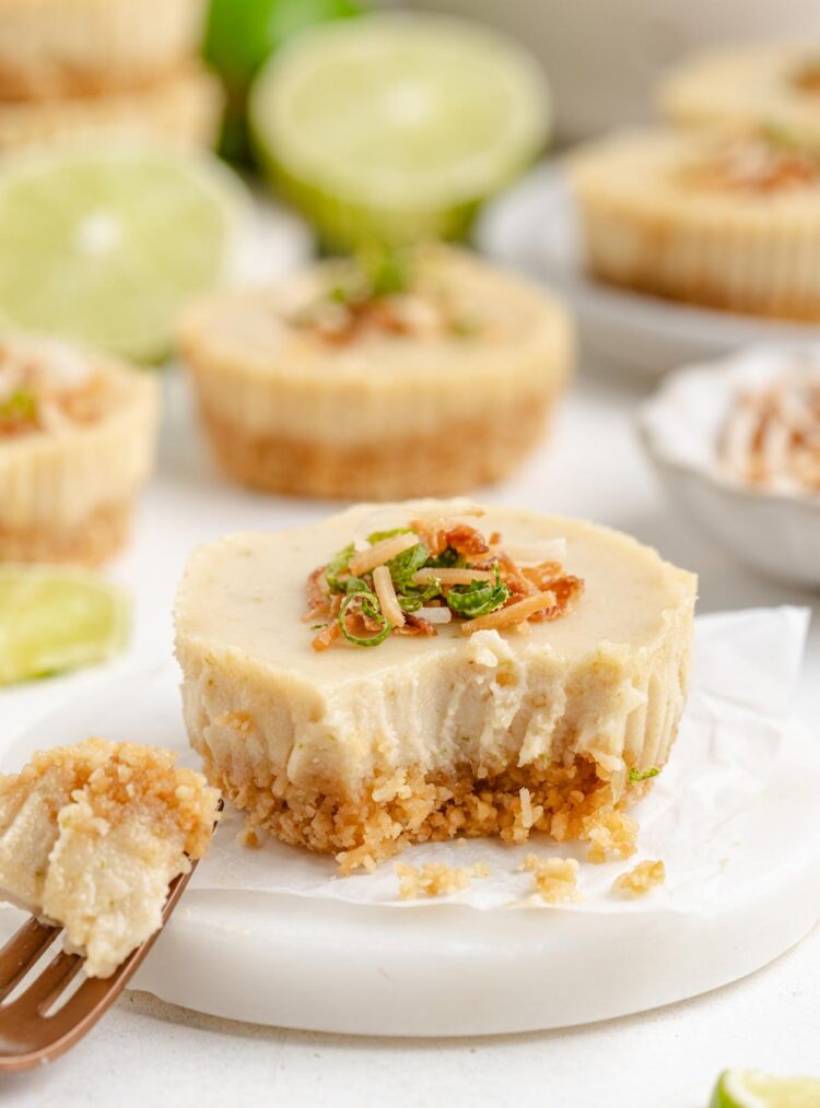 fork digging into a vegan key lime pie on a small dish