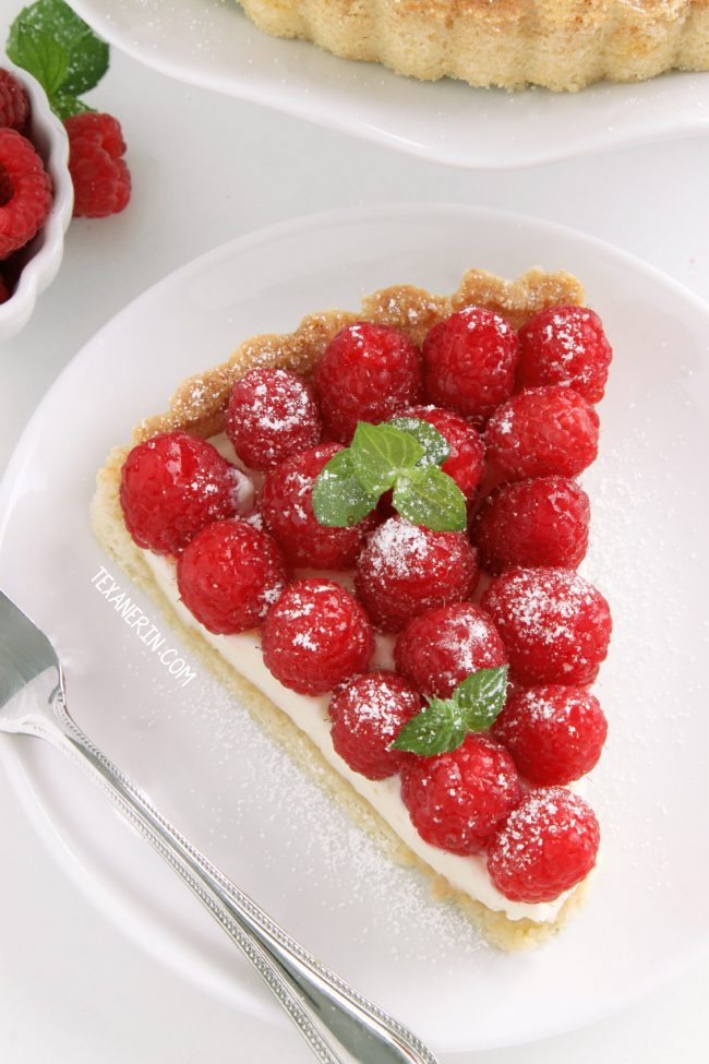 This super delicious raspberry almond tart has a sugar cookie-like crust and almond cream cheese filling. Can be made with gluten-free, whole grain and all-purpose flours.