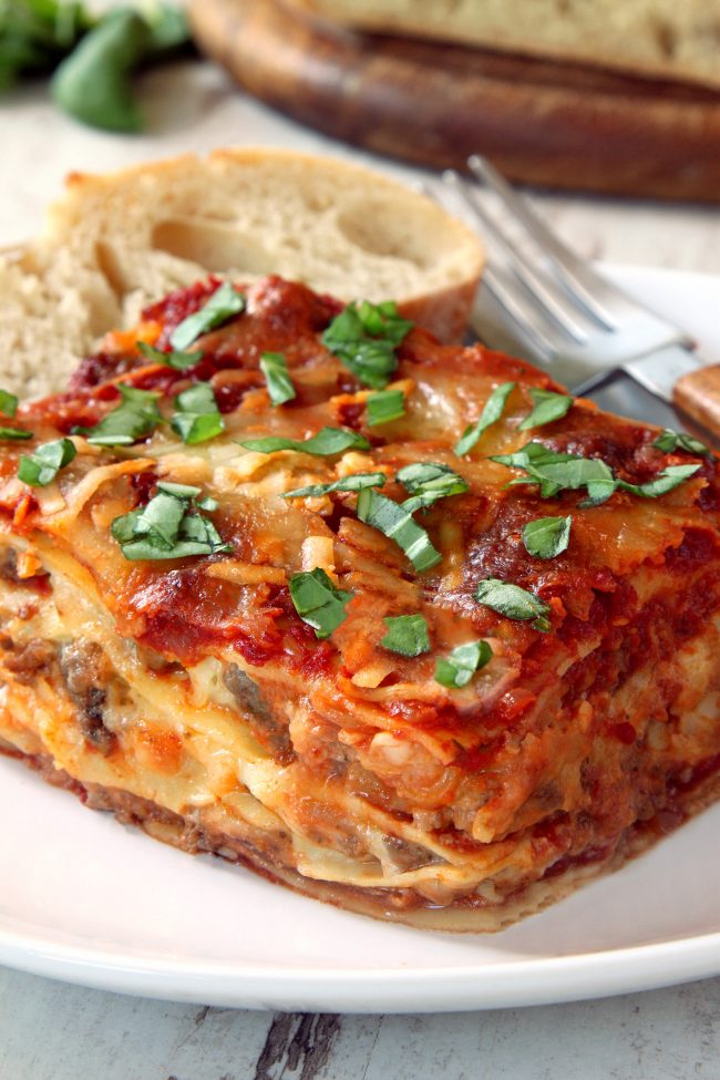 This classic homemade lasagna has homemade red wine sauce, a super creamy cheese filling and can be made with gluten-free, whole wheat or with regular noodles.