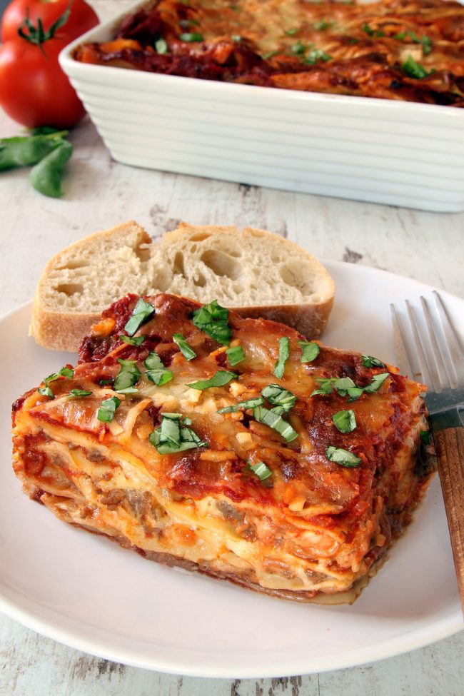 This classic homemade lasagna has homemade red wine sauce, a super creamy cheese filling and can be made with gluten-free, whole wheat or traditional noodles.