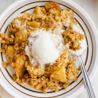 plate of gluten-free apple crisp with ice cream