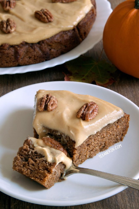 This paleo pumpkin cake is super moist and easy to make! Topped off with maple cream frosting and maple candied pecans.