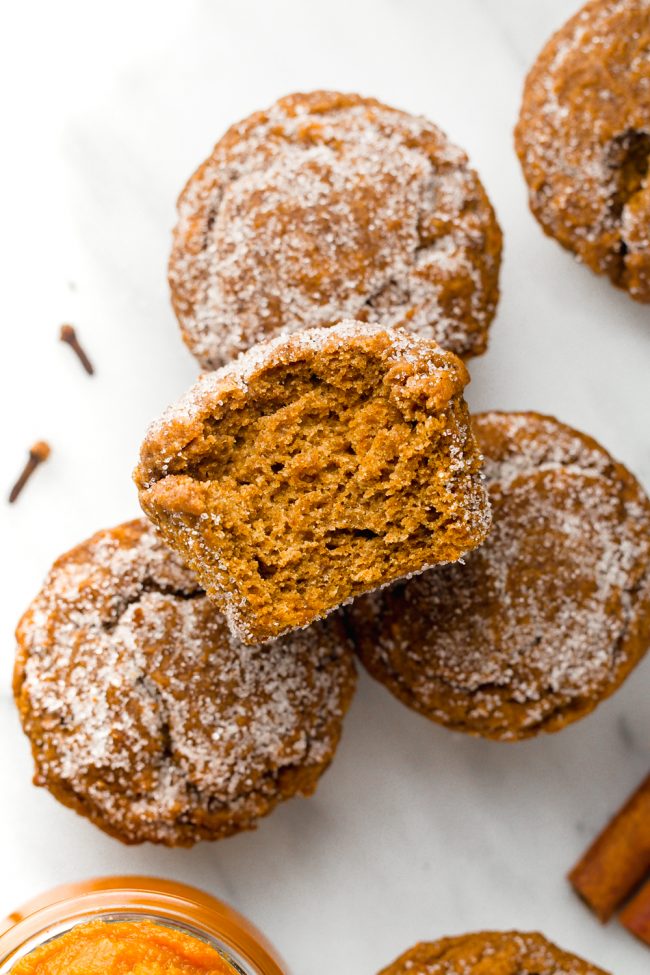 Vegan pumpkin muffins lightly sweetened with maple syrup and covered in cinnamon sugar. With gluten-free and whole wheat options.