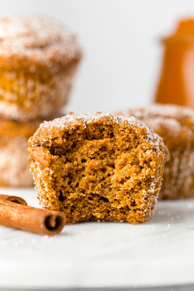 Vegan pumpkin muffins lightly sweetened with maple syrup and covered in cinnamon sugar. With gluten-free and whole wheat options.