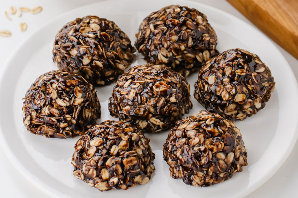 A white plate filled with Gluten Free Chocolate Oatmeal Cookies.