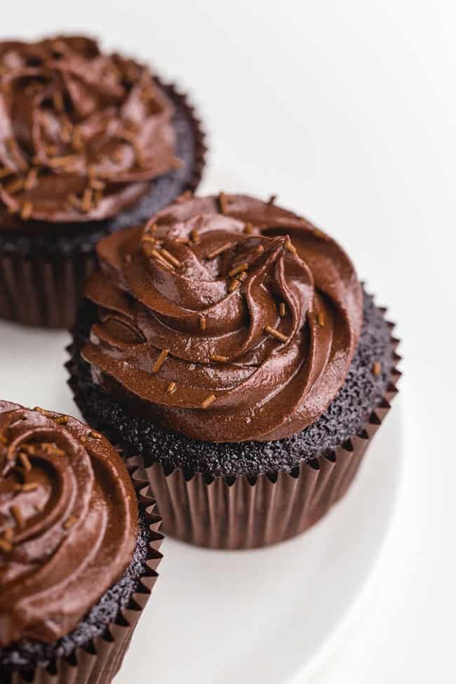 These amazing gluten-free chocolate cupcakes are incredibly moist and just as delicious as traditional cupcakes! With vegan and dairy-free options.