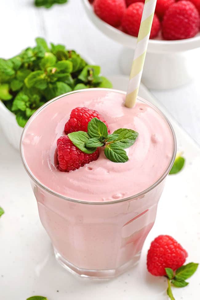 This raspberry smoothie is super thick thanks to bananas, avocado and yogurt and can also be made paleo and vegan by simply using coconut milk yogurt.