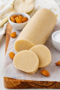 Almond Paste slices on wooden cutting board