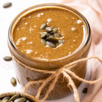 pumpkin seed butter in jar with ribbon