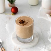 glass of vegan eggnog with spoons