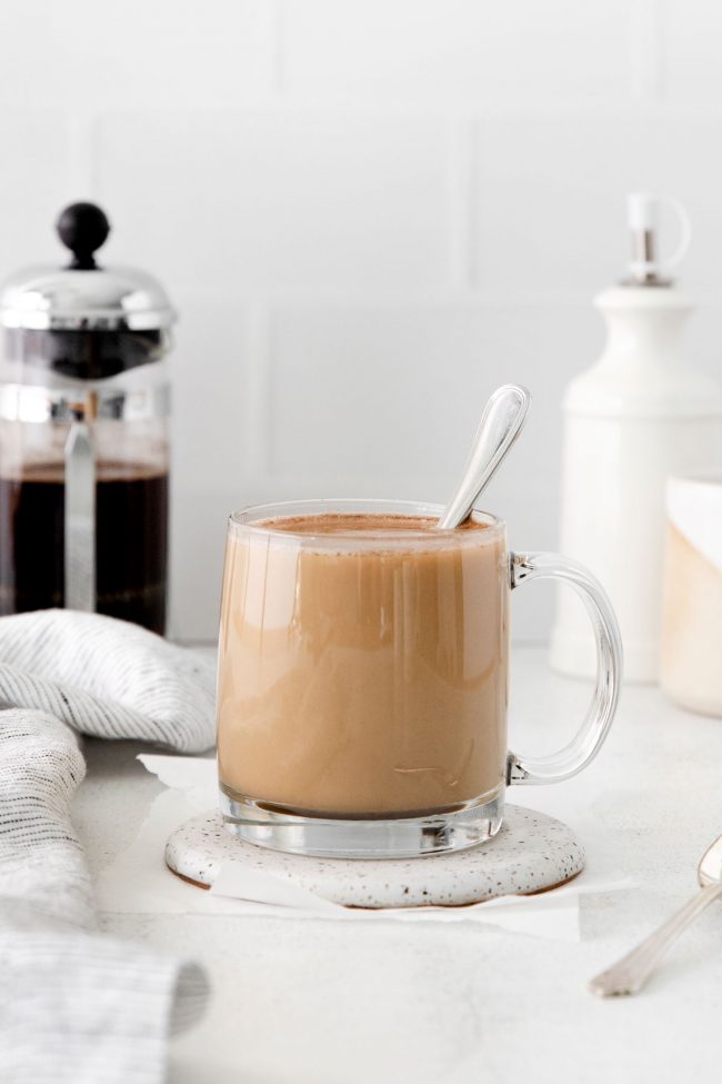 Making cold brew coffee with milk in a french press, also known as a  cafetière, coffee press, or coffee plunger Stock Photo