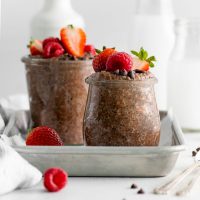 strawberries on top of chocolate protein chia pudding
