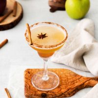 apple margarita with anise star and cinnamon stick on top