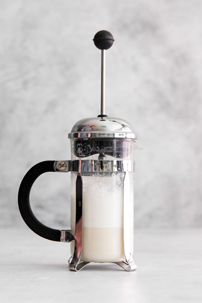 https://www.texanerin.com/content/uploads/2022/09/how-to-froth-almond-milk-with-french-press-step-2-image-650x974.jpg