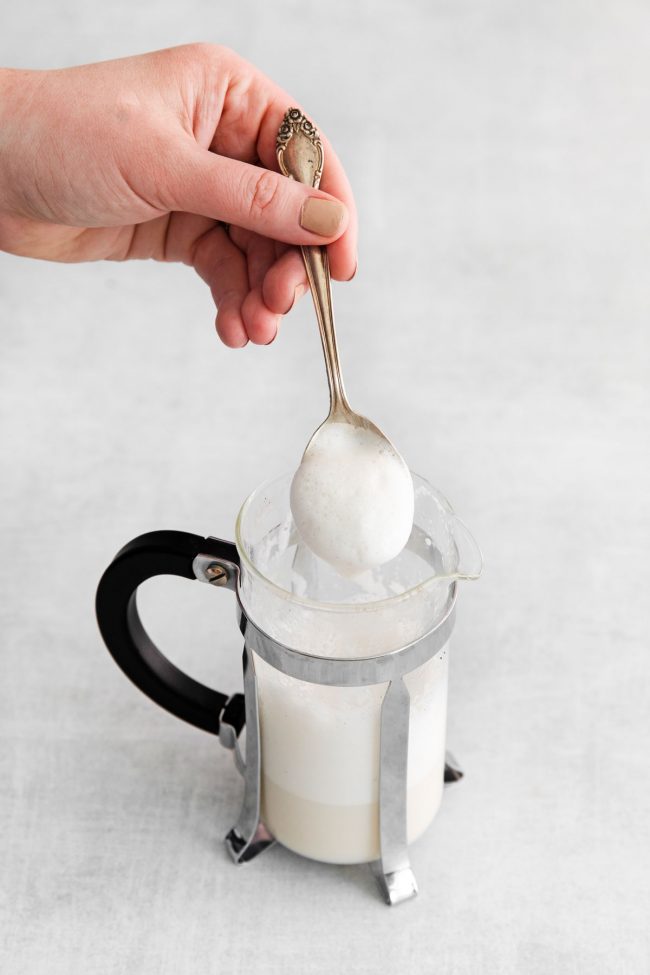 https://www.texanerin.com/content/uploads/2022/09/how-to-froth-almond-milk-with-french-press-step-3-image-650x975.jpg