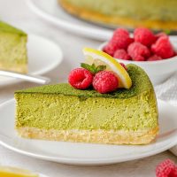 gluten-free cheesecake crust with matcha cheesecake and raspberries