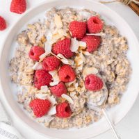 image of a bowl of chia seed oatmeal topped with fresh raspberries