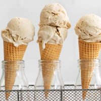close up image of creamy paleo ice cream scooped on ice cream cones