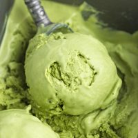 Image showing an ice cream scoop with a vibrant green scoop of matcha ice cream.
