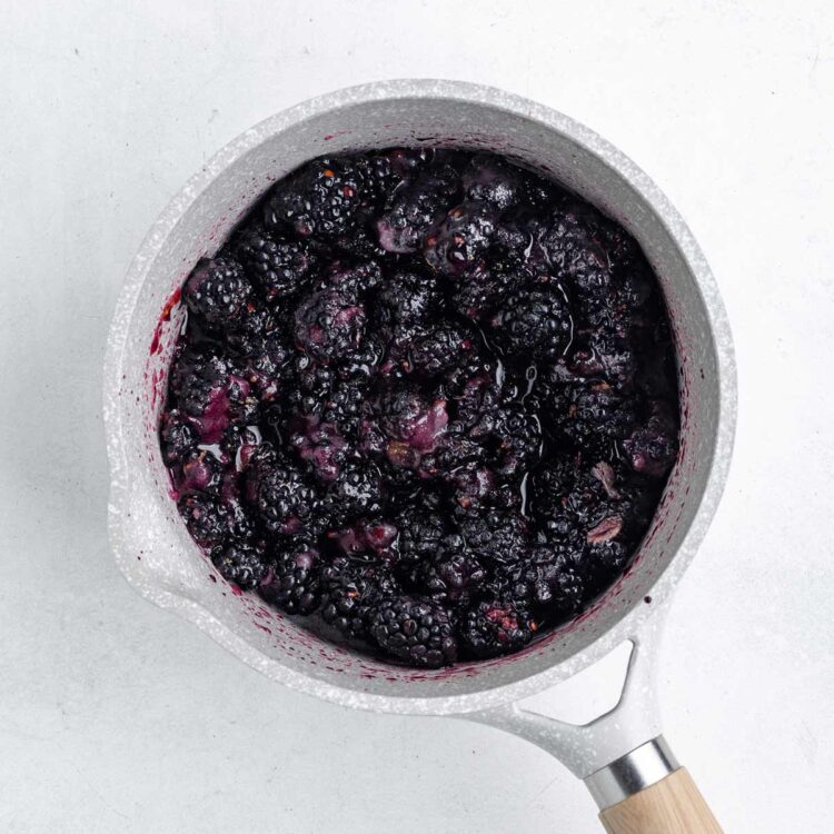saucepan with the ingredients in it to make homemade blackberry jam