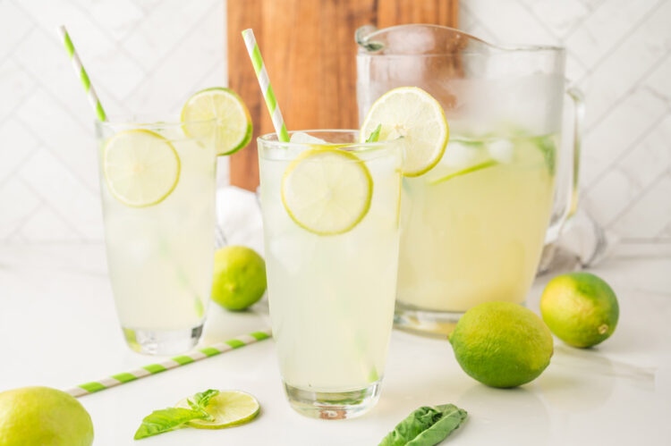 3 glasses of basil limeade on a white table