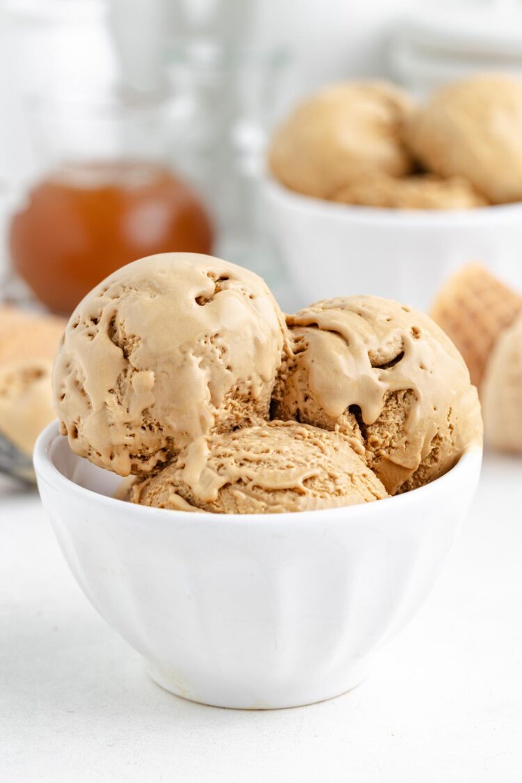 3 scoops of butterscotch ice cream in a white bowl