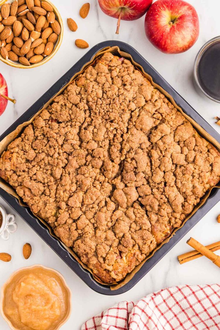 the baked applesauce coffee cake on a white plate