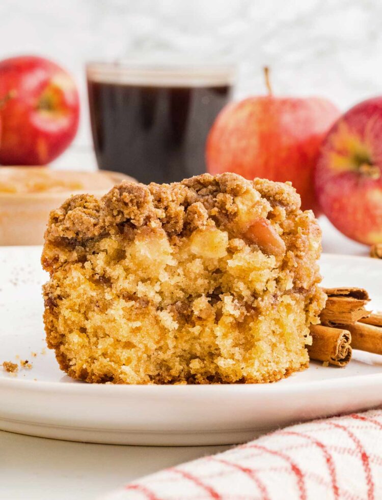 close-up of a pplesauce coffee cake on a white plate