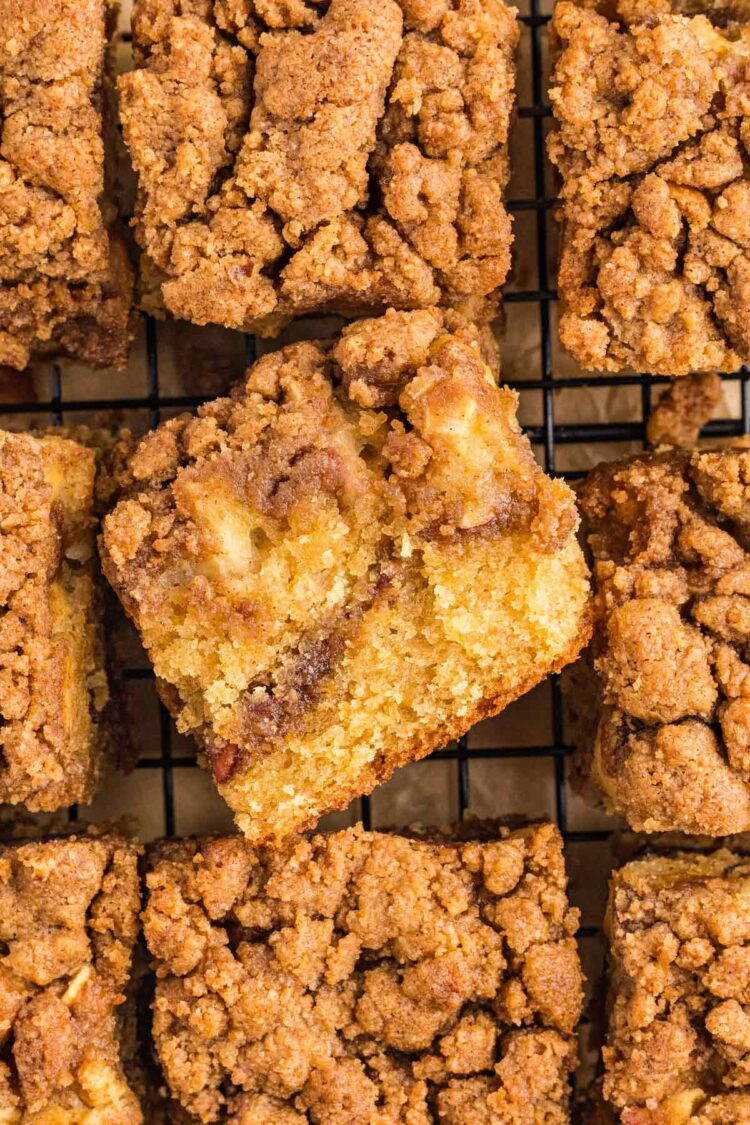 cut up applesauce coffee cake with one piece on its side