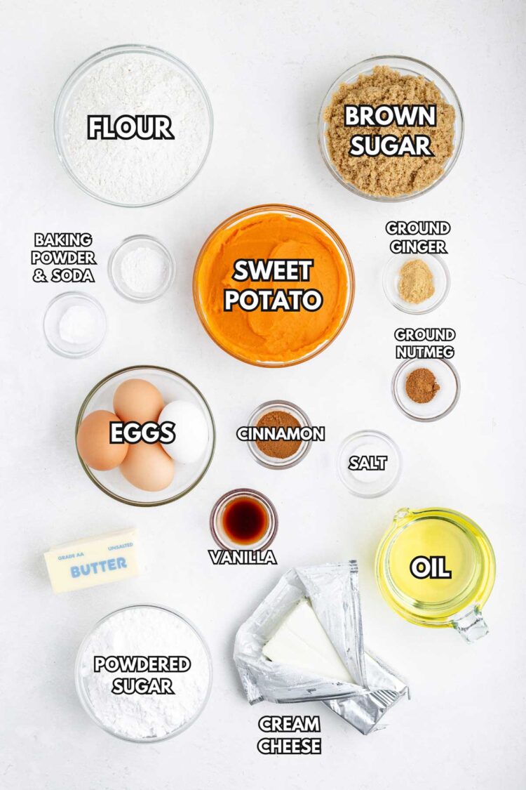 Ingredients for sweet potato cake, including flour, eggs, sweet potato, spices, and cream cheese, arranged on a white background.